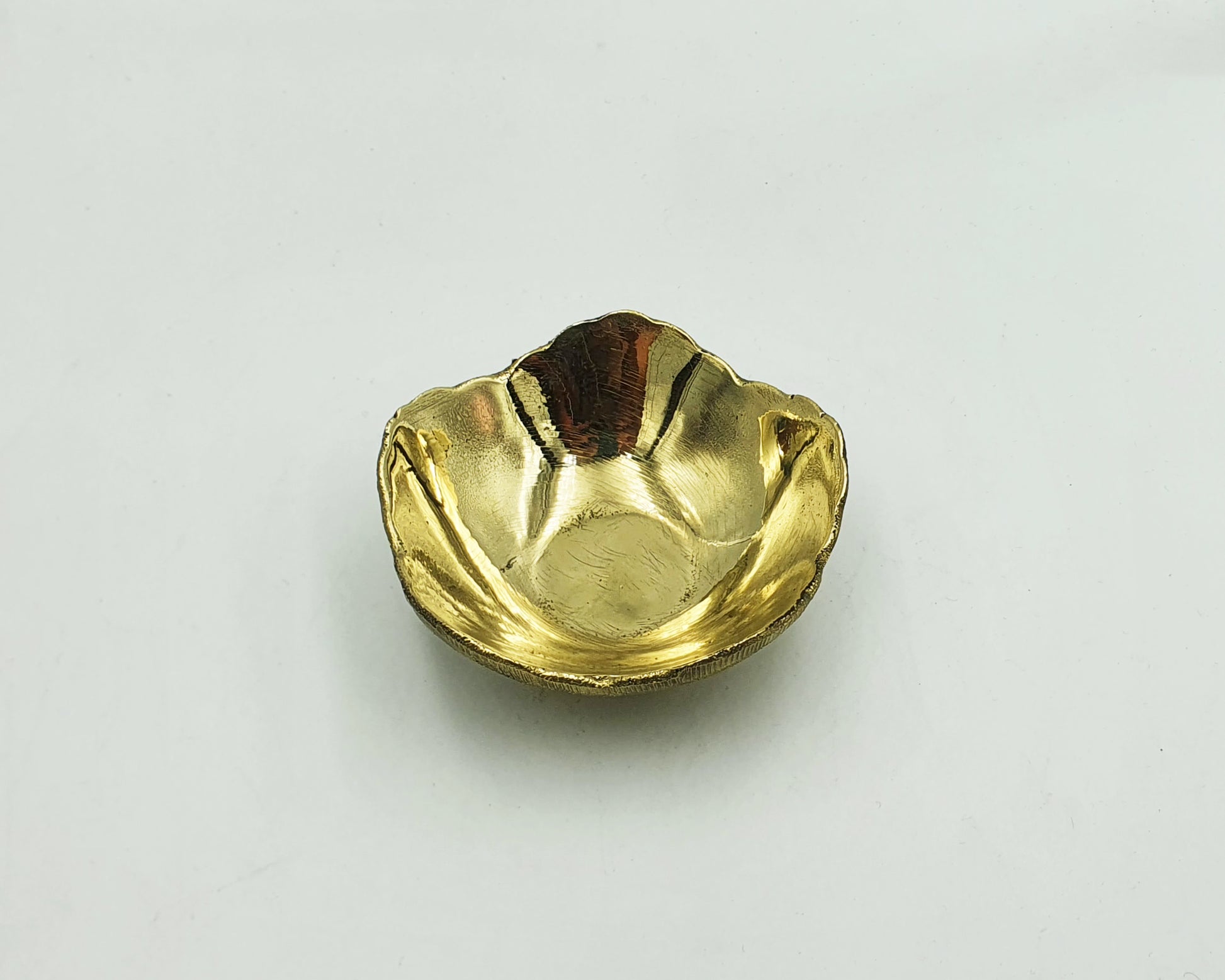 unlacquered brass candle holder